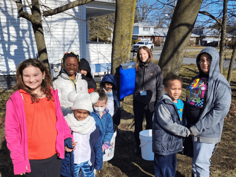 Students with tapped maple tree