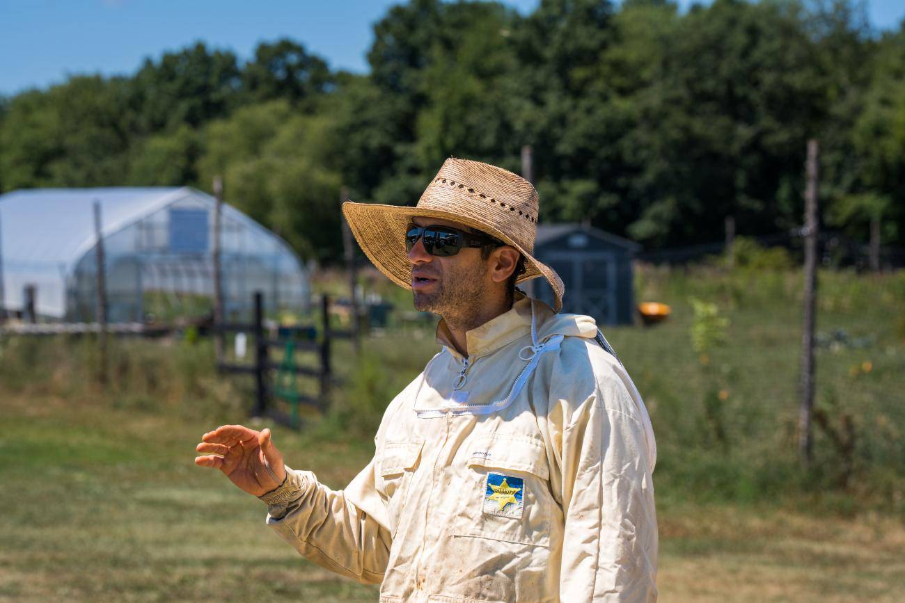 Farmer Sam Rose in sun hat