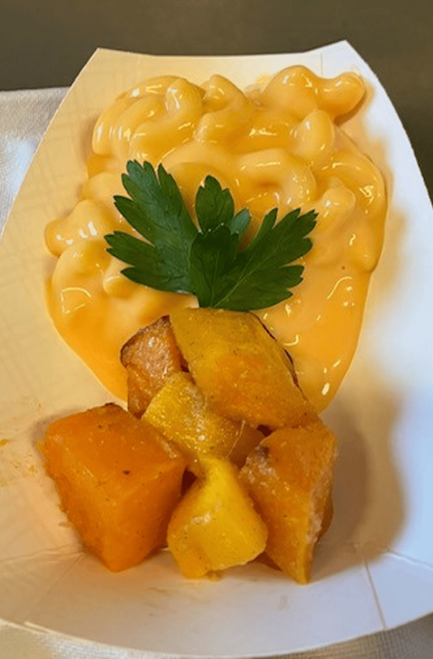 Mac and cheese with cooked squash.