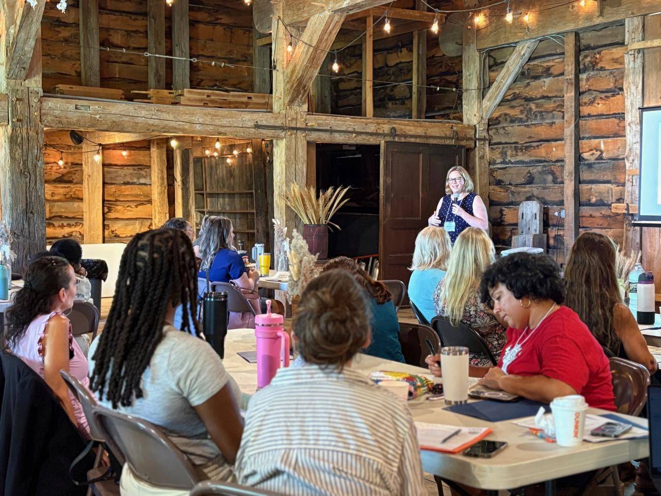 Jenny Lester-Moffit of American Farmland Trust delivers keynote address to a group of people.