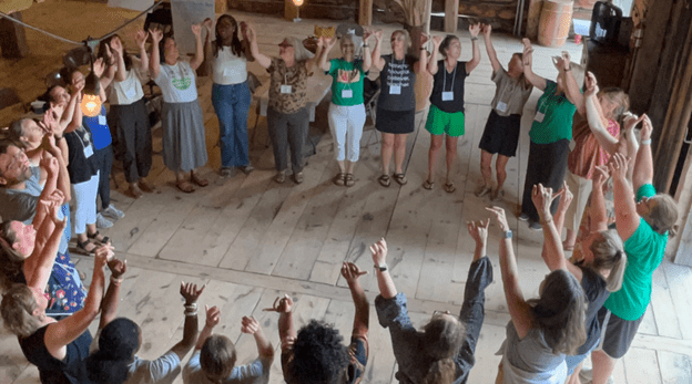 Participants at the 2025 New York Farm to School Institute at the closing circle activity.